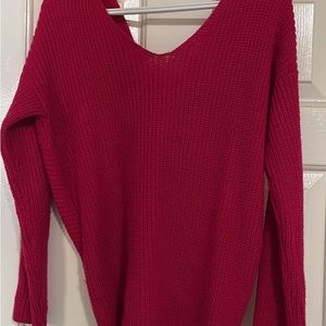 Pink sweater with a bow at the back